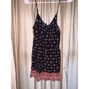 Black and red patterned romper